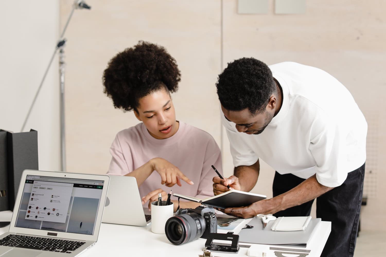 Two creators reviewing their work
