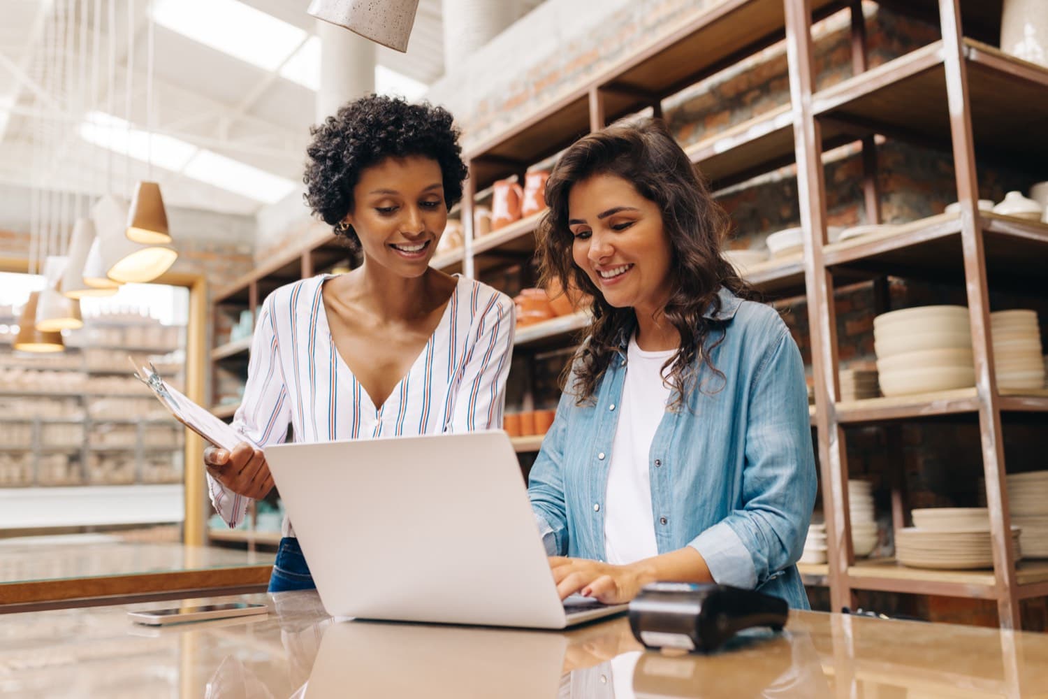 Two business owners reviewing their numbers together